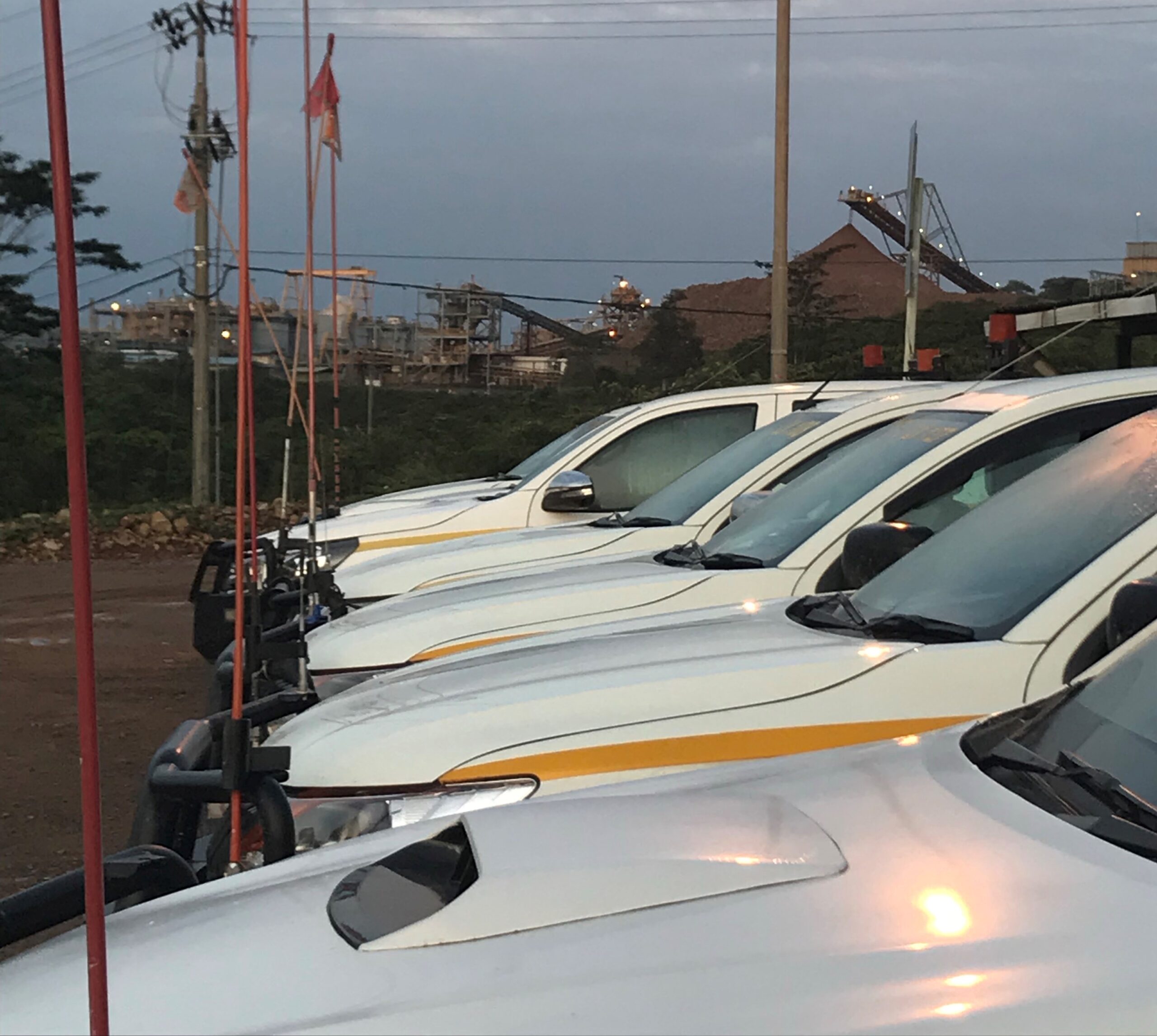 Light vehicles lined up at a mine site